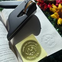 Personalized book embosser featuring a cute dog and “From the Library of” text